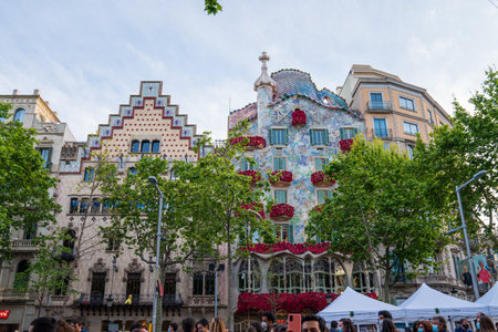 BARCELONA, SPAIN, APRIL 23, 2021: Casa Batllo in Barcelona, one of the most beautiful houses on Passeig de Gracia. By the architect Antoni Gaudi. Decorated with roses for St. Georges Day.のeditorial素材