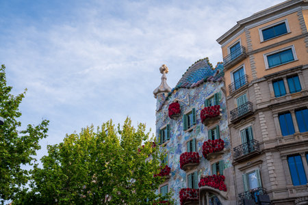 BARCELONA, SPAIN, APRIL 23, 2021: Casa Batllo in Barcelona, one of the most beautiful houses on Passeig de Gracia. By the architect Antoni Gaudi. Decorated with roses for St. Georges Day.のeditorial素材
