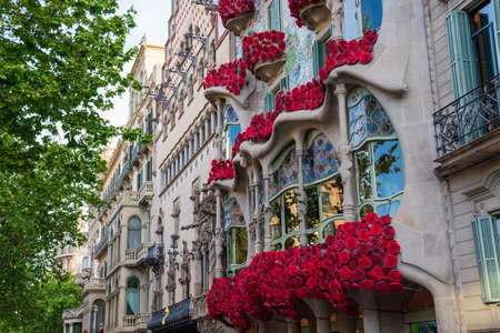 BARCELONA, SPAIN, APRIL 23, 2021: Casa Batllo in Barcelona, one of the most beautiful houses on Passeig de Gracia. By the architect Antoni Gaudi. Decorated with roses for St. Georges Day.のeditorial素材