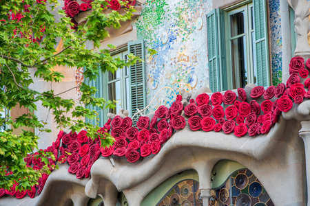 BARCELONA, SPAIN, APRIL 23, 2021: Casa Batllo in Barcelona, one of the most beautiful houses on Passeig de Gracia. By the architect Antoni Gaudi. Decorated with roses for St. Georges Day.のeditorial素材