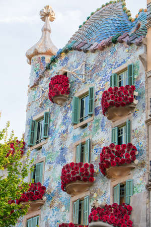 BARCELONA, SPAIN, APRIL 23, 2021: Casa Batllo in Barcelona, one of the most beautiful houses on Passeig de Gracia. By the architect Antoni Gaudi. Decorated with roses for St. Georges Day.のeditorial素材