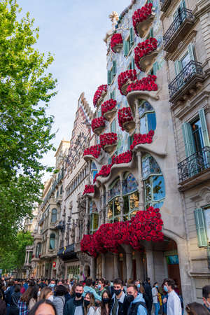 BARCELONA, SPAIN, APRIL 23, 2021: Casa Batllo in Barcelona, one of the most beautiful houses on Passeig de Gracia. By the architect Antoni Gaudi. Decorated with roses for St. Georges Day.のeditorial素材
