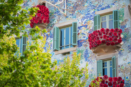 BARCELONA, SPAIN, APRIL 23, 2021: Casa Batllo in Barcelona, one of the most beautiful houses on Passeig de Gracia. By the architect Antoni Gaudi. Decorated with roses for St. Georges Day.のeditorial素材