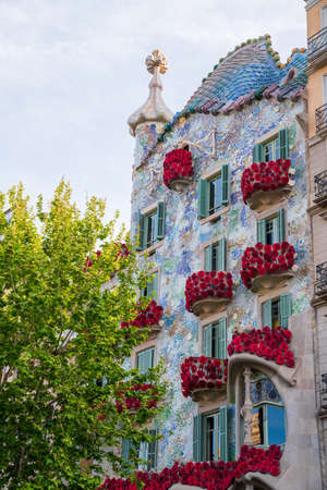 BARCELONA, SPAIN, APRIL 23, 2021: Casa Batllo in Barcelona, one of the most beautiful houses on Passeig de Gracia. By the architect Antoni Gaudi. Decorated with roses for St. Georges Day.のeditorial素材