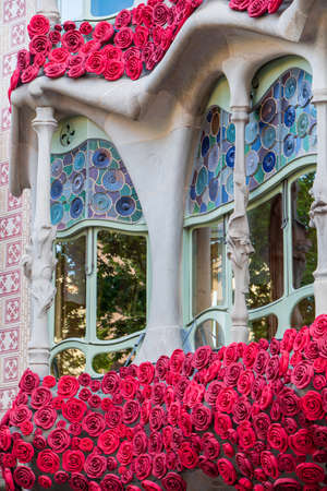 BARCELONA, SPAIN, APRIL 23, 2021: Casa Batllo in Barcelona, one of the most beautiful houses on Passeig de Gracia. By the architect Antoni Gaudi. Decorated with roses for St. Georges Day.のeditorial素材