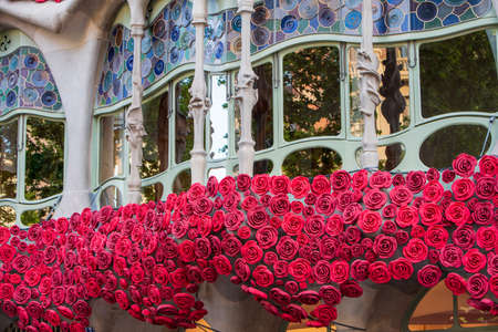 BARCELONA, SPAIN, APRIL 23, 2021: Casa Batllo in Barcelona, one of the most beautiful houses on Passeig de Gracia. By the architect Antoni Gaudi. Decorated with roses for St. Georges Day.のeditorial素材