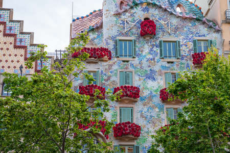 BARCELONA, SPAIN, APRIL 23, 2021: Casa Batllo in Barcelona, one of the most beautiful houses on Passeig de Gracia. By the architect Antoni Gaudi. Decorated with roses for St. Georges Day.のeditorial素材