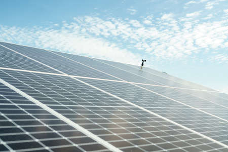 Field of solar panels to generate green and sustainable energy for the industries in the area.の写真素材