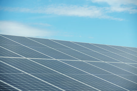 Field of solar panels to generate green and sustainable energy for the industries in the area.の写真素材