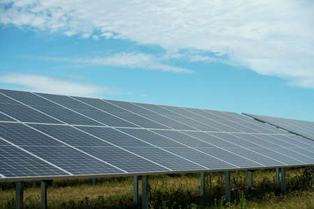 Field of solar panels to generate green and sustainable energy for the industries in the area.の写真素材