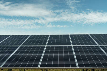 Field of solar panels to generate green and sustainable energy for the industries in the area.の写真素材