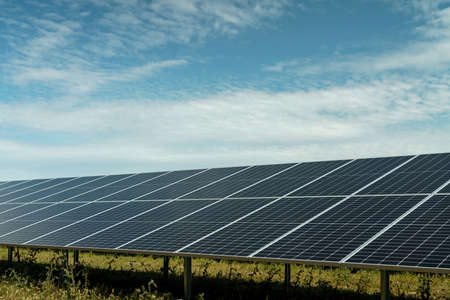 Field of solar panels to generate green and sustainable energy for the industries in the area.の写真素材