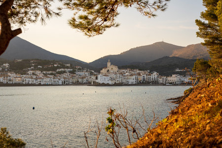 Cadaques, Spain. February 2023. Enjoy a stunning sunset in Cadaques, where the warm tones of the sun blend with the cool hues of the sea, creating a spectacular visual contrast on the coastal horizon.の写真素材