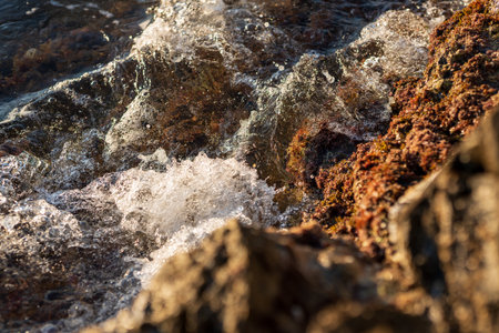 Cap de Creus Alt Emporda, Spain. February 2023 Rugged rocky coastline with turquoise waters in contrast. Sharp rocks extend out to the sea, creating a dramatic and wild texture.の写真素材