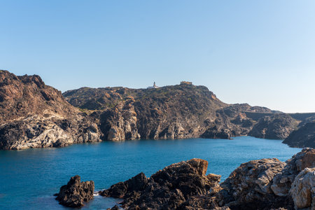 Cap de Creus Alt Emporda, Spain. February 2023 Rugged rocky coastline with turquoise waters in contrast. Sharp rocks extend out to the sea, creating a dramatic and wild texture.の写真素材