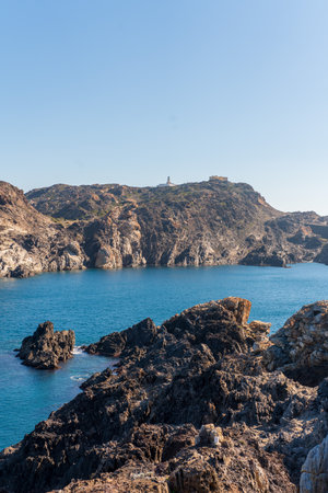 Cap de Creus Alt Emporda, Spain. February 2023 Rugged rocky coastline with turquoise waters in contrast. Sharp rocks extend out to the sea, creating a dramatic and wild texture.の写真素材