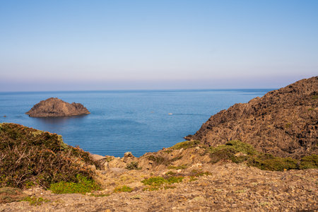 Cap de Creus Alt Emporda, Spain. February 2023 Rugged rocky coastline with turquoise waters in contrast. Sharp rocks extend out to the sea, creating a dramatic and wild texture.の写真素材