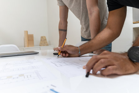 Two young architects working in their studio on a projectの写真素材