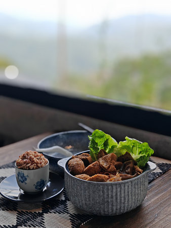 Vegetarian Herbal Soup 45 degree angle shot with forest window view
