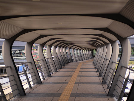 Kuala Lumpur, Malaysia - August 26, 2025 : 
Vertical, Eye-Level Perspective of a Modern Pedestrian...
