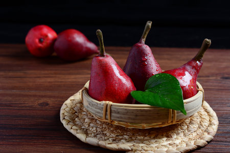 Red Pears in a basketの写真素材
