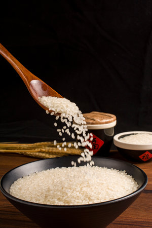 rice in a wooden spoonの写真素材