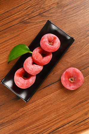 Healthy and nutritious fresh red persimmons are on the tableの写真素材