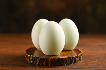 Close up colorful red yolk of salted duck eggs preserved in bamboo basket, asian style foodの写真素材