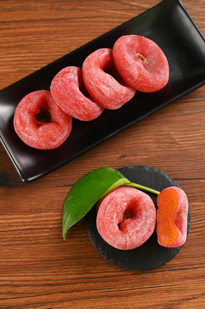 Healthy and nutritious fresh red persimmons are on the tableの写真素材