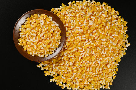 Cereal grains in a bowl on a black background, top viewの写真素材