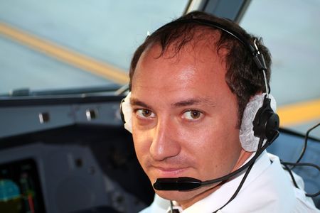 Airplane pilot in cockpitの写真素材