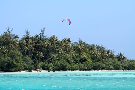 kitesurf at waterstart on a turquoise lagoonの写真素材