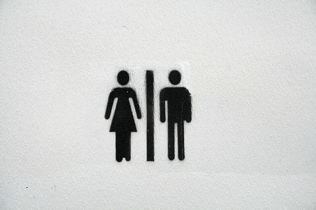 men and women logo on a restrooms doorの写真素材