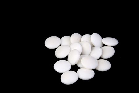 white go game stones on black background