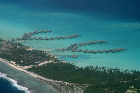 overwater bungalows in a coral reef ressortの写真素材