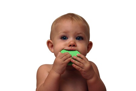 baby eating her plastic toysの写真素材