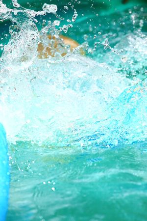 water splash in a blue poolの写真素材