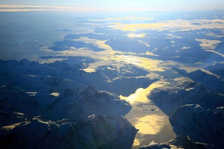 greenland sunset over ocean and mountainsの写真素材