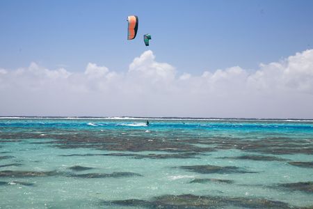 kitesurfers on a blue lagoonの写真素材