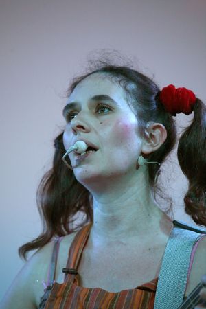 woman singer with guitar on sceneの写真素材