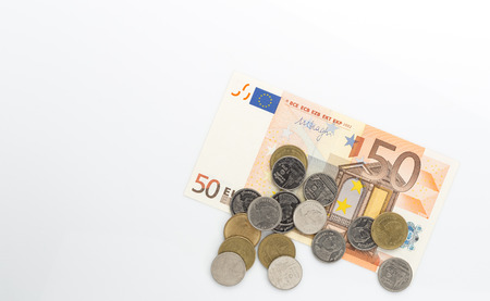 Euro banknotes and coin on white backgroundの写真素材
