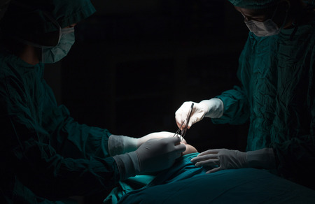 Plastic surgery wrinkle reduction , asian man during surgery using a scalpel , Plastic surgery.の写真素材