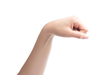 Woman hand with fist gesture Isolated on white with clipping path includedの写真素材