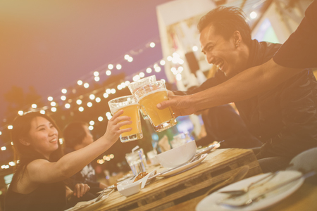 Group Of Friends celebrating the festival and Enjoying Evening Drinks,vintage style.の写真素材