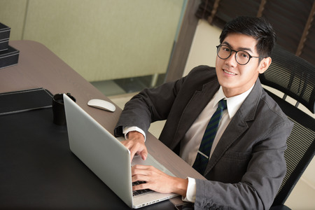 Business man working at office with laptop on his desk, consultant lawyer concept.の写真素材