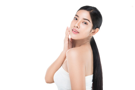Portrait of Beautiful Skin care woman enjoy and happy,touching her face,isolated with clipping path.の写真素材