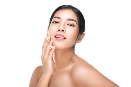 Portrait of Beautiful Skin care woman enjoy and happy,touching her face,isolated with clipping path.の写真素材