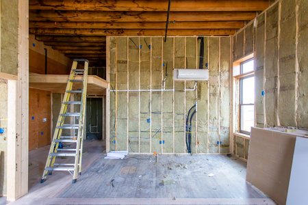 Interior of a new house under construction with scaffolding and ladderの写真素材