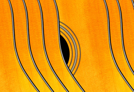 Acoustic guitar close-up. Abstract background and texture for design.