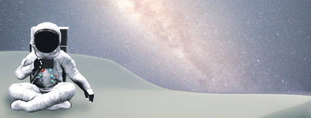 Astronaut sitting on a planet in space against starry sky 3d-illustrationの写真素材